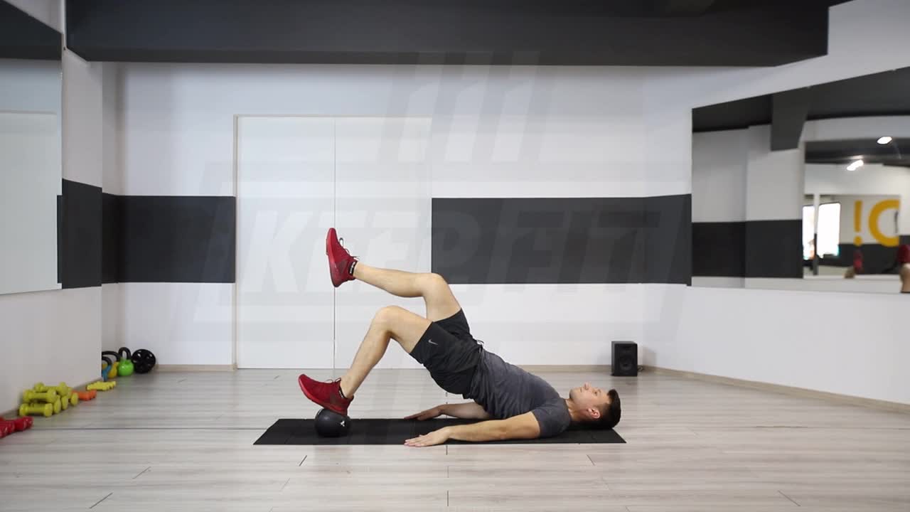 Single-Leg Hip Raise With Foot On Medicine Ball