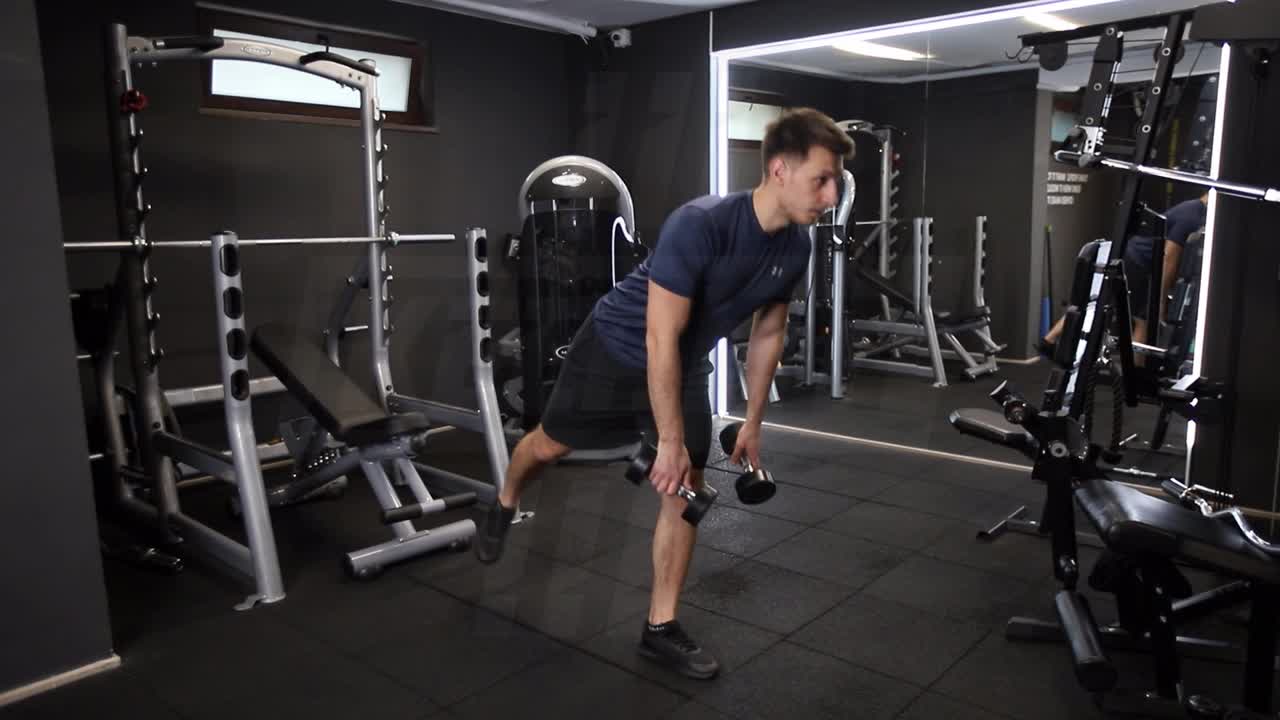 Rotational Dumbbell Straight-Leg Deadlift