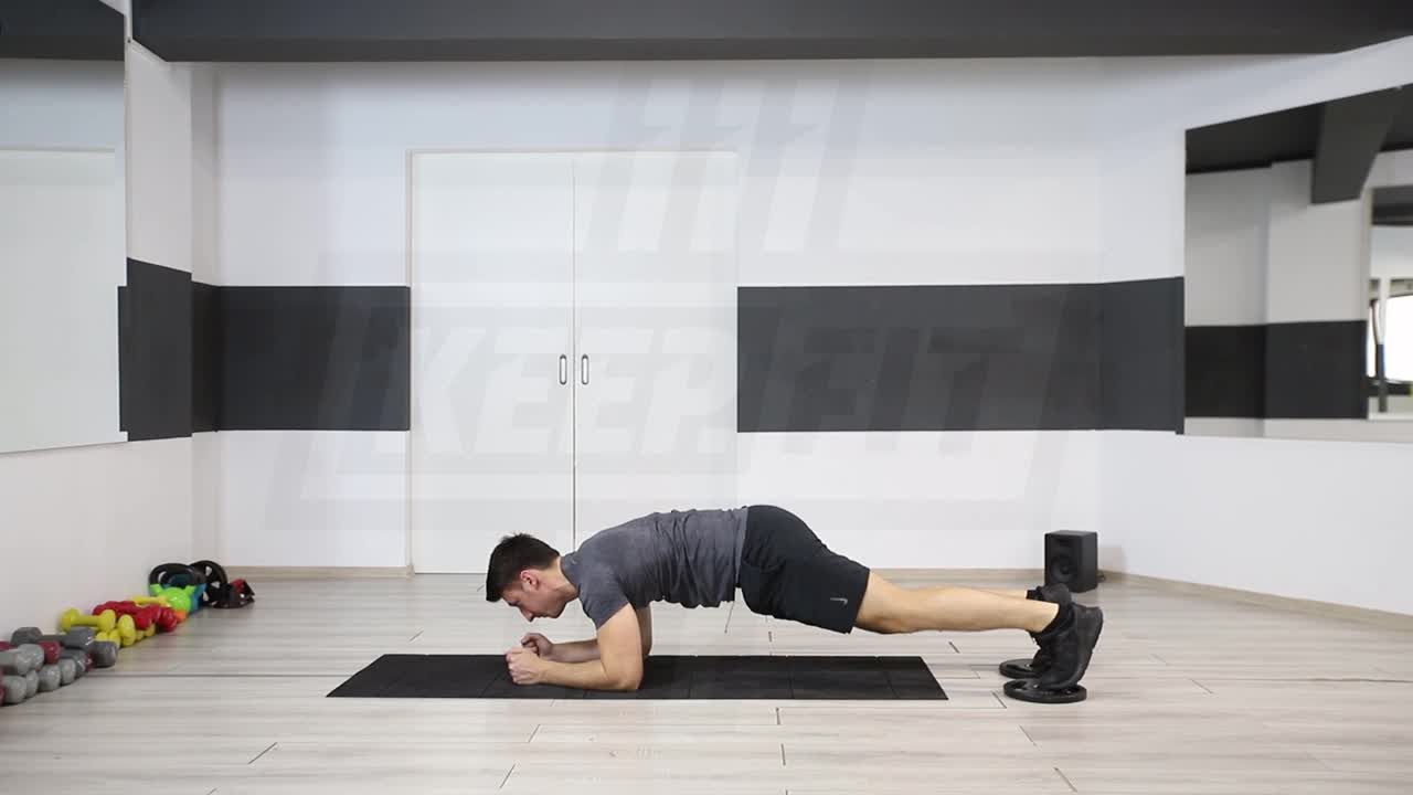 Plank Jacks With Feet On Sliding Discs