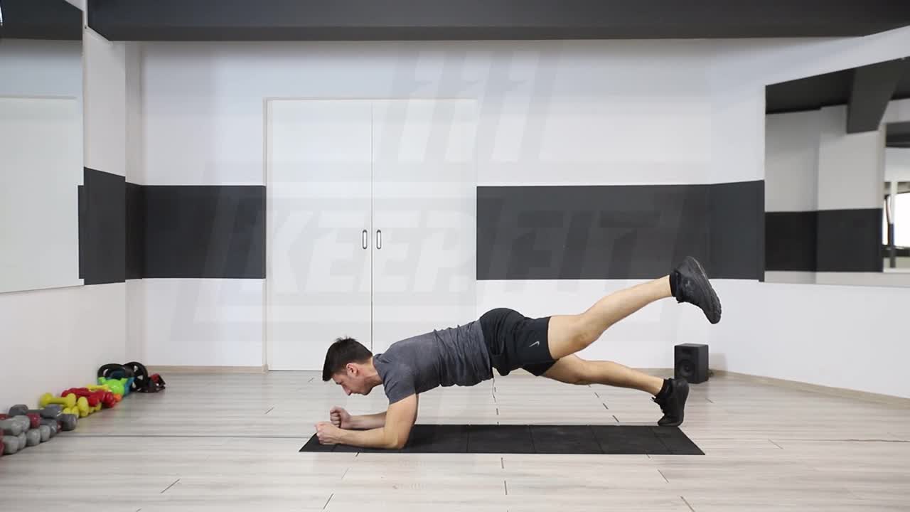 Wide-Stance Plank With Diagonal Leg Lift