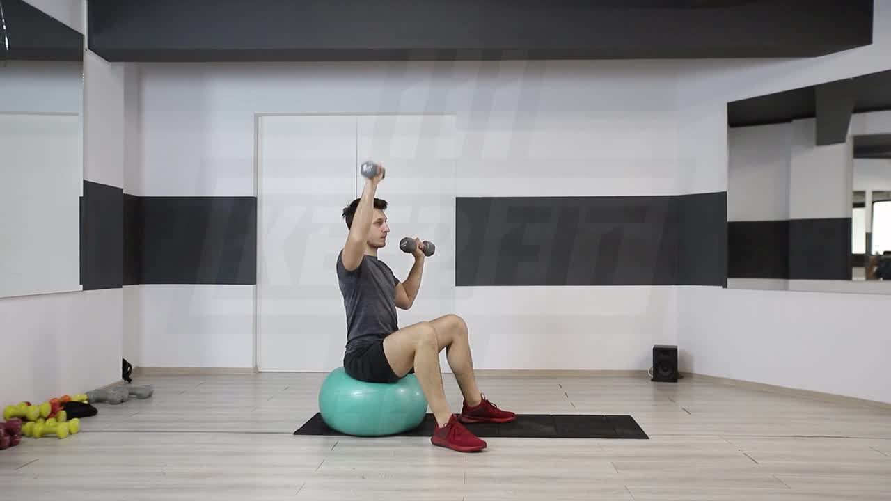 Alternating Swiss Ball Dumbbell Shoulder Press