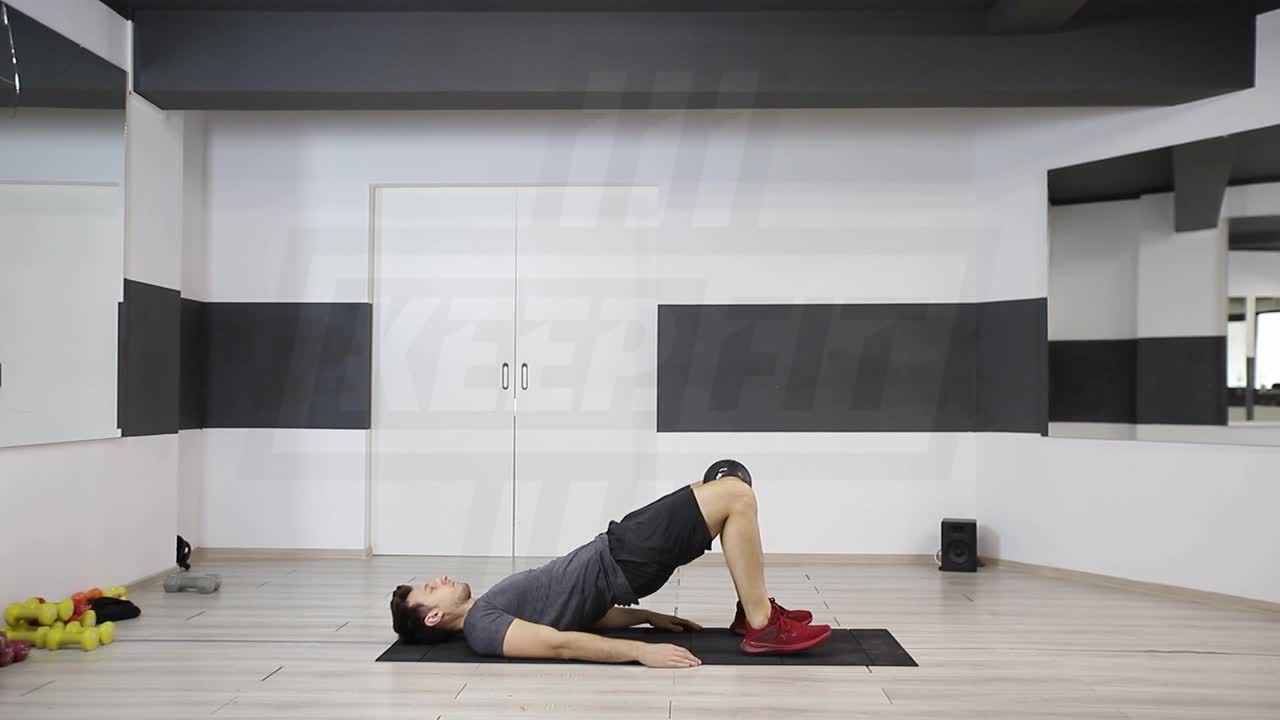 Hip Raise With Knee Squeeze