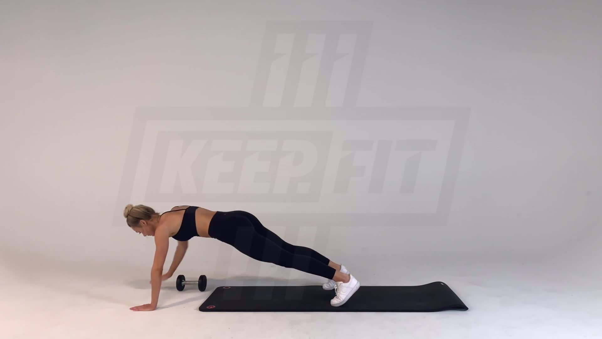 High Plank Dumbbell Drag